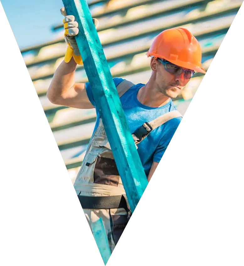 Roofer carrying timber onto a new roof structure